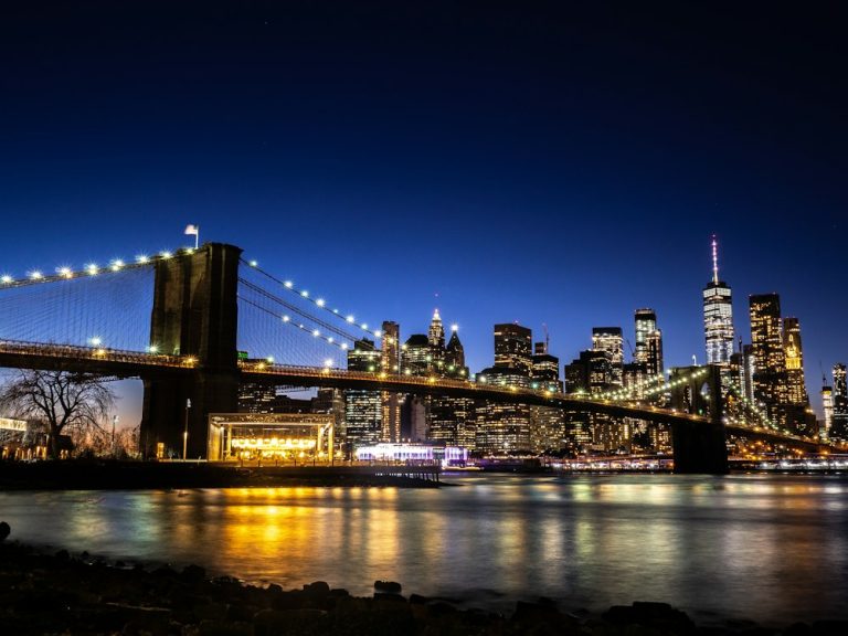 Brooklyn Bridge lit up at dusk